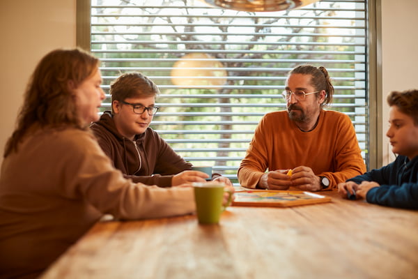 Family playing board games at the table