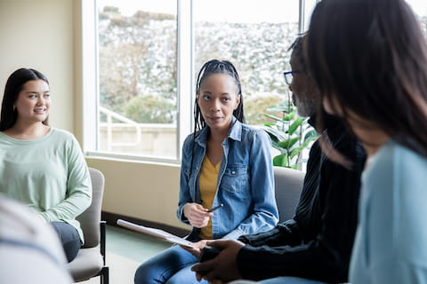 Woman discussing in group