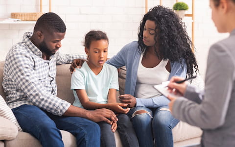 family talking to therapist
